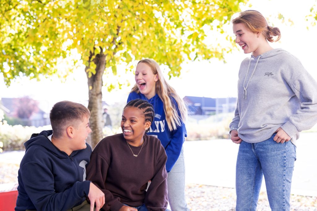 Teens laughing together